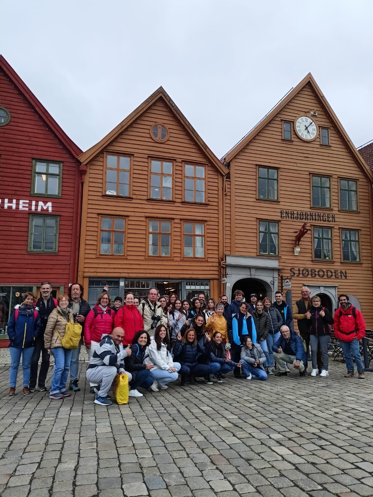 Tour group gathered in front of Bryggen in Bergen